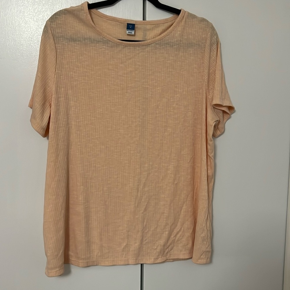 Loose fitting T-shirt.